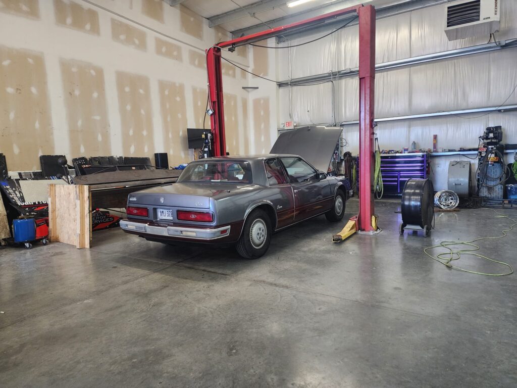 older Buick in the mechanics shop