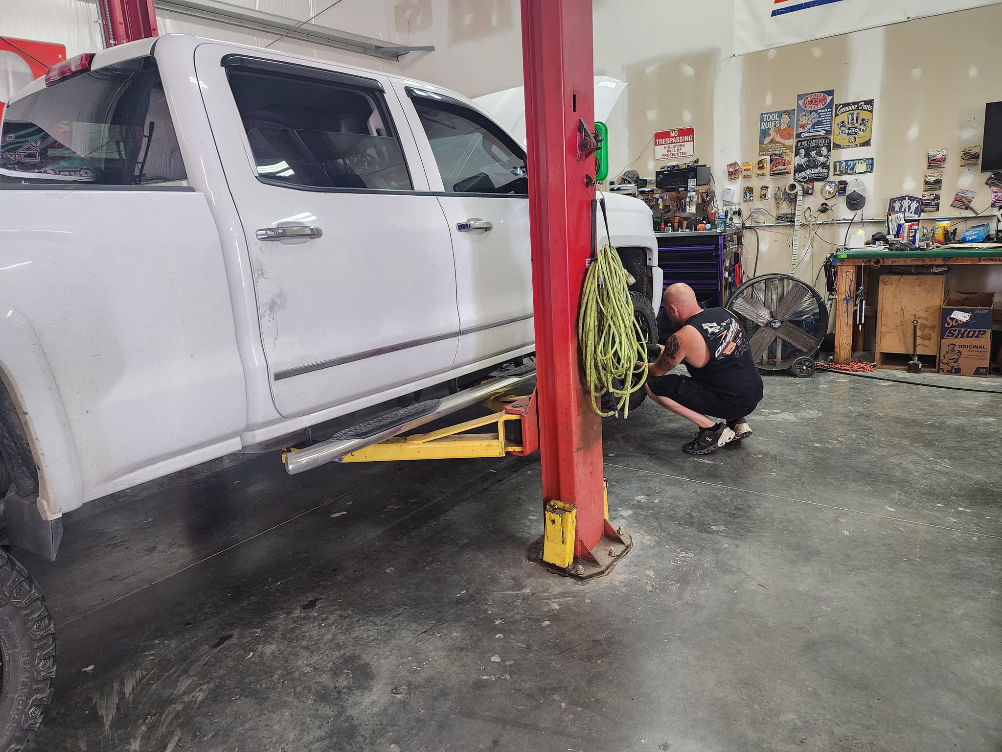 brakes work on a truck in the shop.